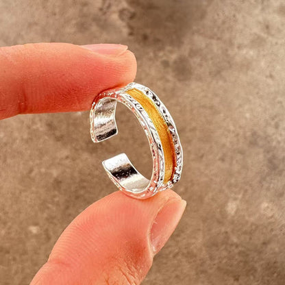 Men's ring with adjustable wide face opening